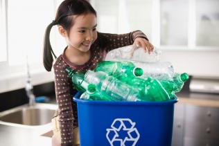 Girl with box of recycling