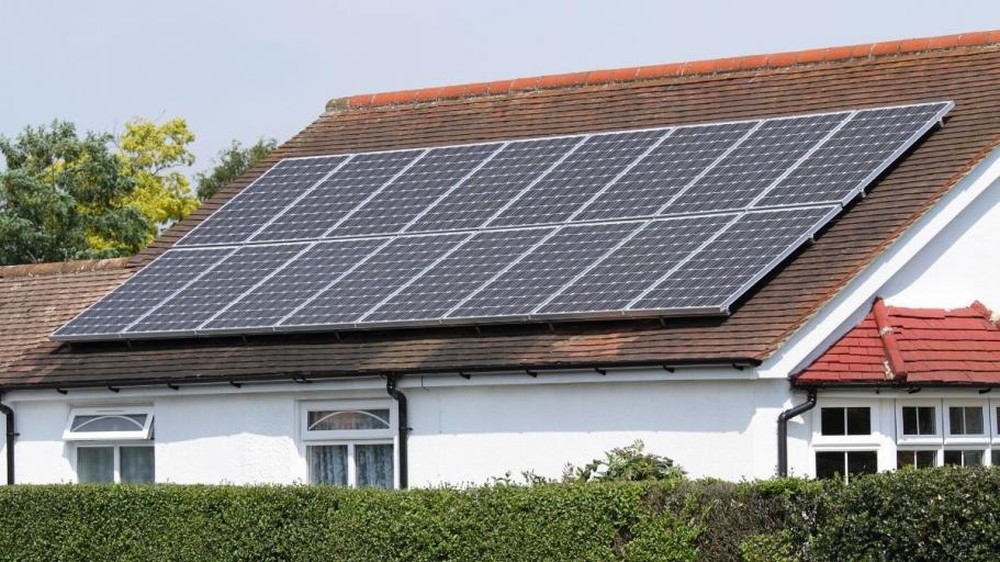 Photo of house with solar panels on roof