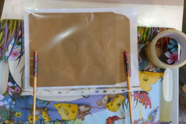 The back of the sign, with two chopsticks sellotaped to it